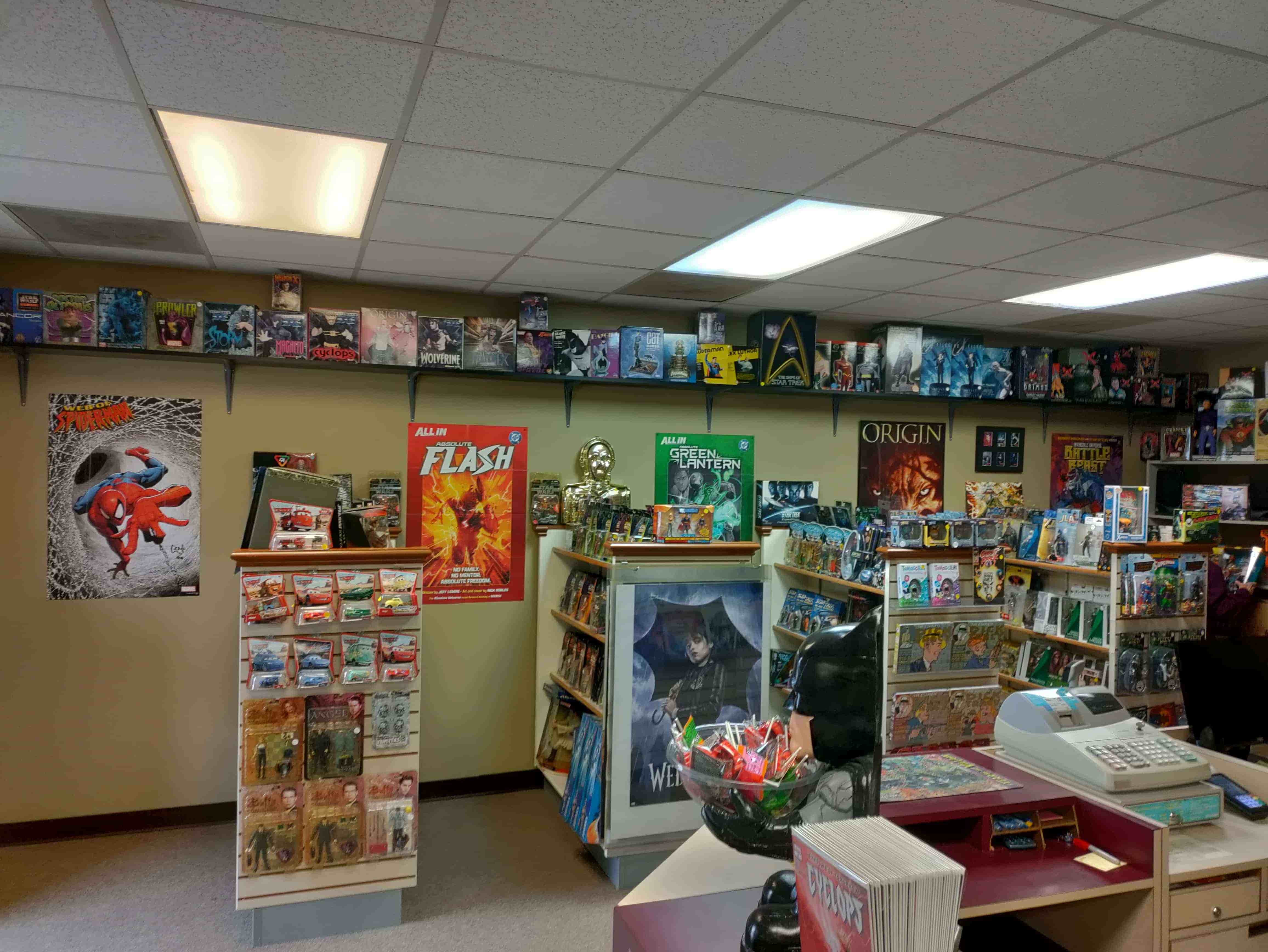 Store interior with collectibles and comics on shelves
