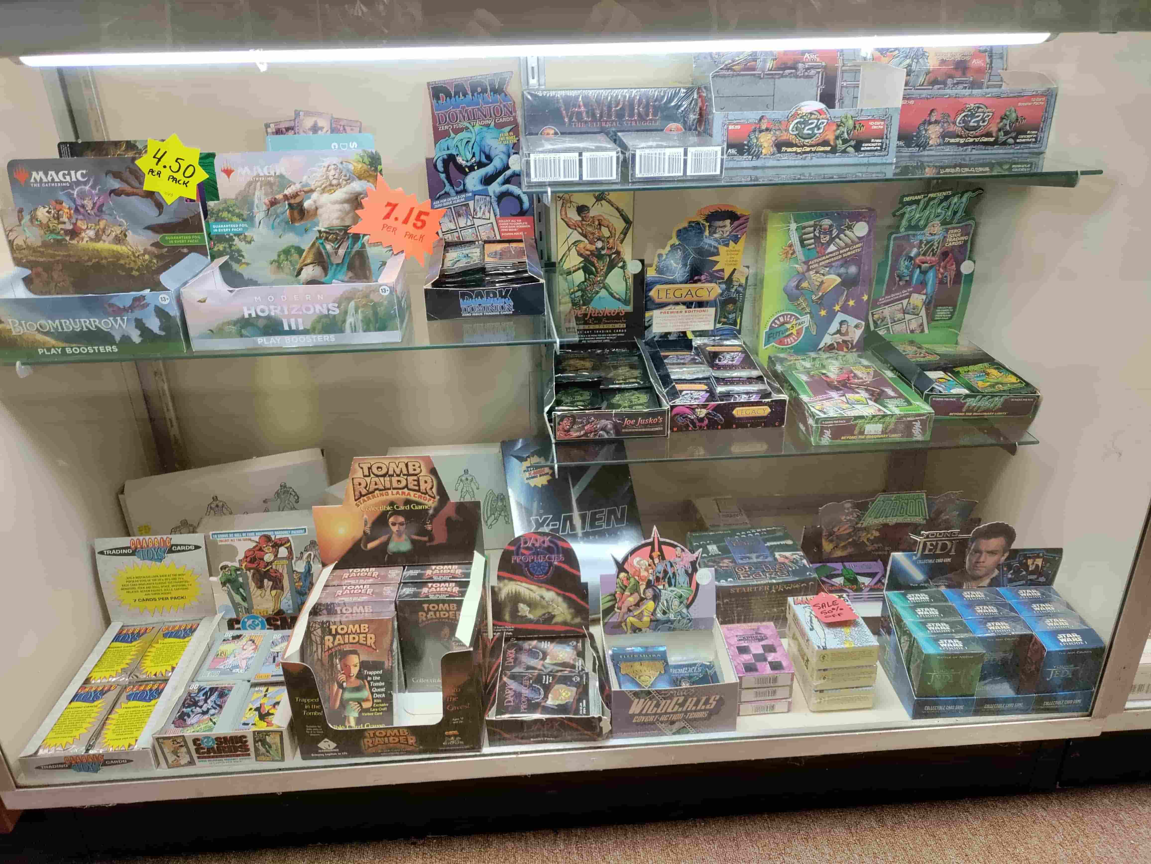 Trading card display case with Magic, Star Wars, and vintage cards
